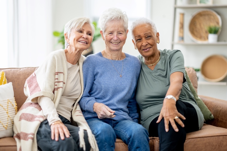Happy women smiling on couch